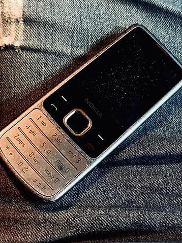 200 manata telefon: Nokia 6700 Slide — 1