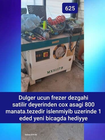 gunəş paneli kamera: Ağ rəngli MX5117B model frezer dəzgahı. Dəzgahın üst hissəsi taxta — 1