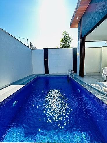 Mərdəkanda yerləşən isti, hovuzlu bağ evimiz xidmətinizdədi,xidmətə