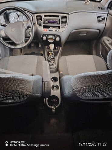 автомобиль фольксваген поло: Kia Rio: 1.4 л | 2006 г. Хэтчбэк — 5