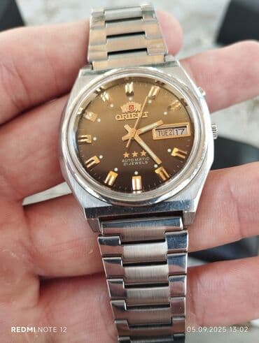 omega qol saatı: İşlənmiş, Qol saatı, Orient, rəng - Qızılı — 1