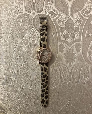 Qadın qol saatı - Korpus: qızılı tonlu dairəvi korpus, kənarı daş — 1