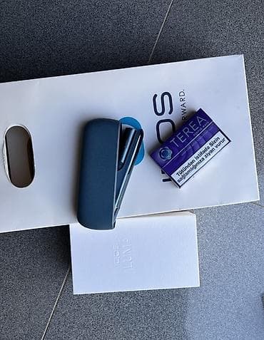IQOS ILUMA – Tütün isitmə cihazı dəsti Məhsulun tərkibi: - IQOS ILUMA — 2
