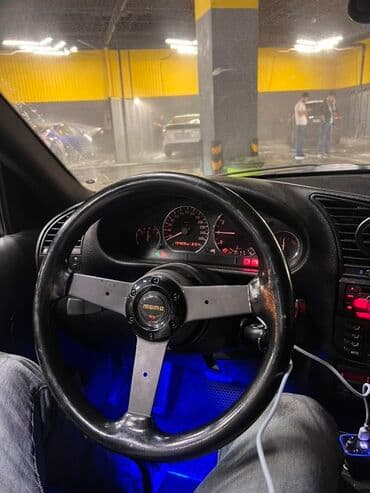 momo sukan: MOMO sükan — idman üslublu, üçşüalı, qara rəngdə, mərkəzdə “MOMO” — 1