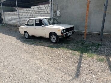 ваза напольная стеклянная высокая без узора: Model: VAZ 2106 sedan Xüsusiyyətlər: - Rəng: ağ, 4 qapı - Mexaniki — 3