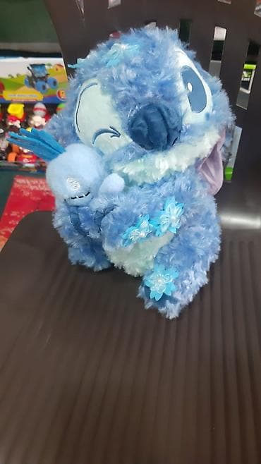 Uşaq geyimi və ayaqqabıları: Mavi plyuş oyuncaq – yumşaq, tüklü materialdan hazırlanmış, qucaqlanan — 1