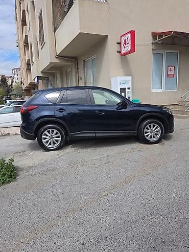 bmw x1 20d xdrive: Mazda CX-5: 2 l | 2014 il Krossover — 3