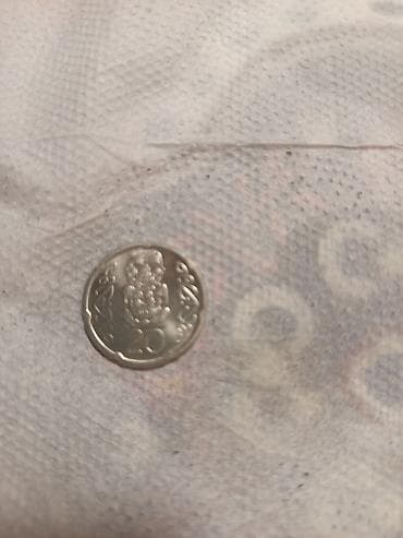 İdman və hobbi: Məhsul: 20 sentlik sikkə (Yeni Zelandiya) Təsvir: - Nominal: 20 cents — 2