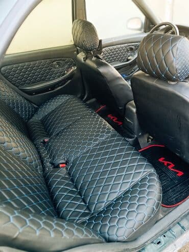 əllə çəkilmiş maşın şəkilləri: Kia Sephia sedan - Kuzov: 4 qapılı sedan, tünd yaşıl rəng - Ön hissə — 7