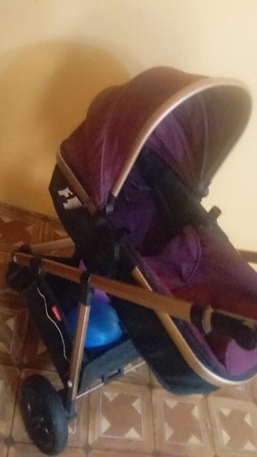 Uşaq arabası – dərin bənövşəyi rəngdə, qızılı çərçivə ilə alıcıya