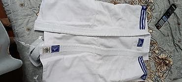 Adidas judo kimanusu. Tezedir - Rəng: ağ, mavi üç zolaqlı detal -