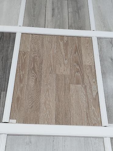 Məhsul: Laminat döşəmə panelləri – müxtəlif ağac teksturaları və