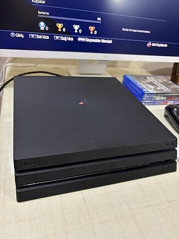 ps4 gamepad: LG 24” Full HD monitor + PlayStation 4 Pro (1TB) oyun dəsti Paketin — 9