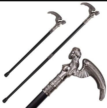 Yerimək üçün arabalar, çəliklər, əsalar, rollatorlar: Qanadlı mələk fiquru ilə bəzədilmiş bu əsa, dəstəyi gümüşü rəngdə — 2