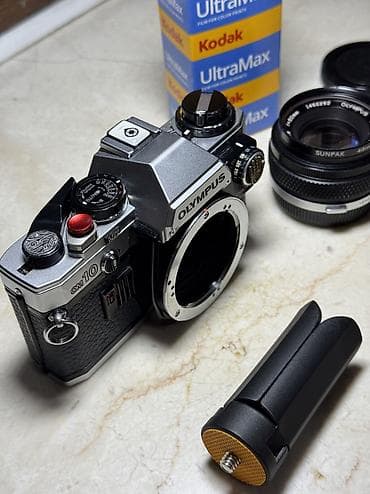 instax mini 12 en ucuz: 1979-cu il Yaponiya istehsalı. Olympus OM 10 35 mm film ilə işləyən — 4