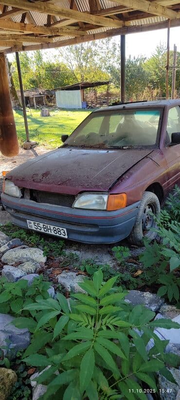 запчасти на форд фокус 1: Ford Orion sedan – 4 qapı, bənövşəyi/qırmızı rəng. Nömrə: 55-BH-883 — 4