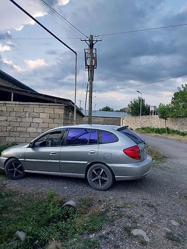 mersedes yan guzguler: Kia Rio universali (station wagon), gümüşü rəng. - Kuzov: 5 qapılı — 3