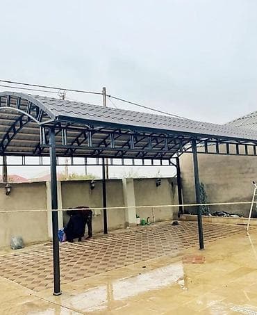 dam örtükləri işlənmiş: Metal konstruksiyalı, polikarbonat örtüklü avtomobil kölgəsi. Bu kölgə — 2