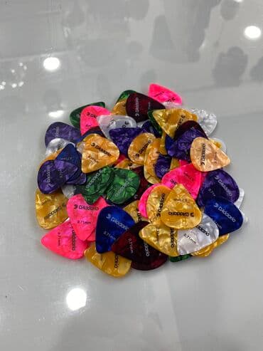 toy gitarası: Daddario mizrab — 1