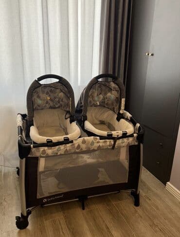 uwaq bezi: Əkiz uşaq maneji çox funksionaldır. Üstündəki səbətləri ayrı — 1