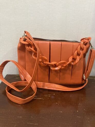 Toy paltarları və aksesuarları: Narıncı rəngli çiyin/çapraz çanta - Material: yumşaq eko‑dəri - Rəng — 1
