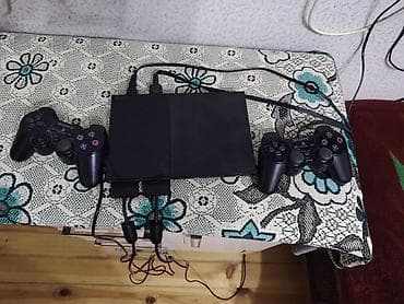 iphone 15 pro max çakma: Sony PlayStation 2 Slim oyun konsolu - Model: PS2 Slim (SCPH — 2