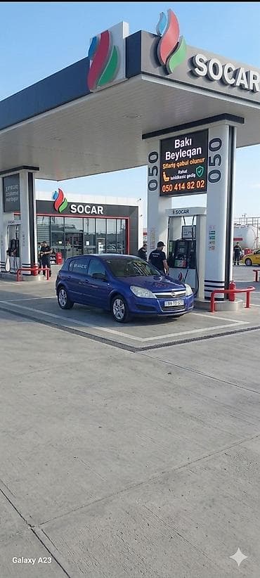 larzon disk: Opel Astra Caravan (universal), mavi rəng. Kuzov: 5 qapılı, geniş — 3