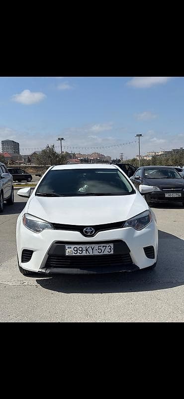 carolla disk: Toyota Corolla, ağ rəng,sedan gövdə. I - Nömrə nişanı: 99-KY-573 — 9