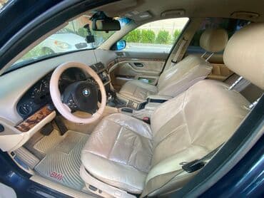 aston martin db7 5.9 at: BMW 5 series: 2.5 l | 2000 il Sedan — 7