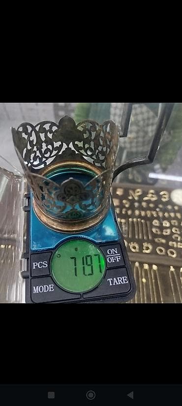 şeki: Açıq işli naxışlara malik metal stəkanaltı (podstakanik). - Material — 1