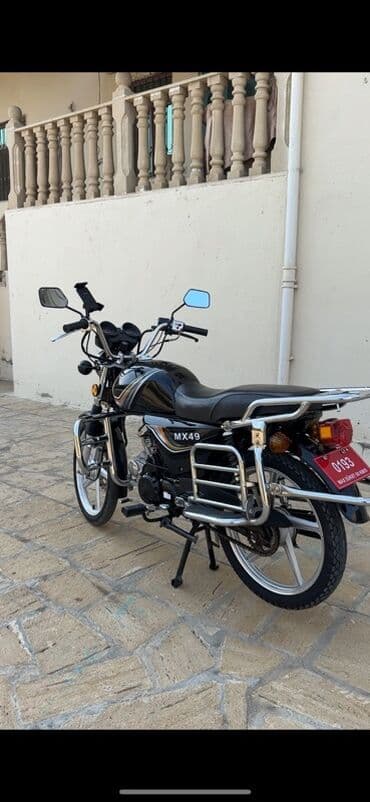 18 disk təkər: Moto: MX49 moped/motosiklet Xüsusiyyətlər: - Rəng: qara, dekorativ — 2