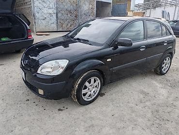 kia cerato 2010: Kia Rio hatchback – qara rəng, 5 qapı. Xüsusiyyətlər: - Kuzov — 2