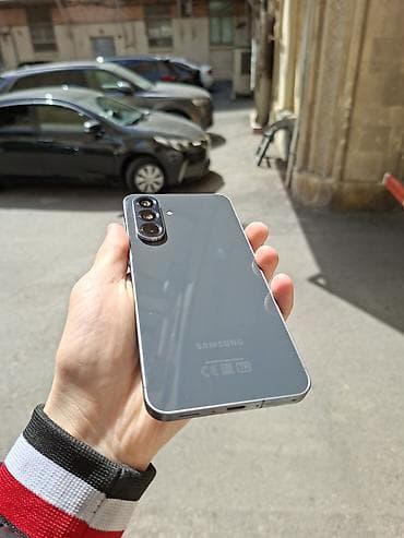 Мобильные телефоны и аксессуары: Samsung Galaxy A56 5G, 128 ГБ, цвет - Серый, Отпечаток пальца, Две SIM карты, Face ID — 5