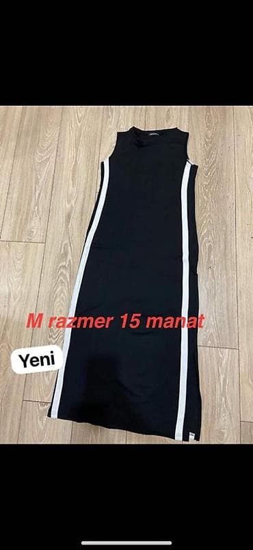 Qara rəngli, qolsuz, dar kəsimli uzun don. Yanlardan aşağıya doğru