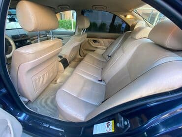 aston martin db7 5.9 at: BMW 5 series: 2.5 l | 2000 il Sedan — 6