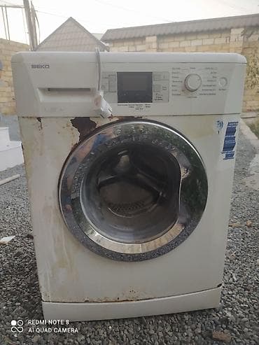 Beko paltaryuyan maşın, ön yükləməli model. Üzərində görünən əsas