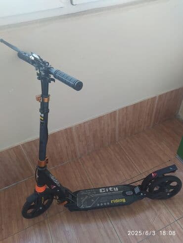 samakat islenmis: Qara və narıncı rənglərdə olan "City Riding" markalı skuter — 2