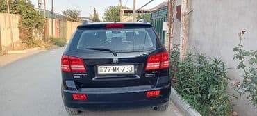 şlanqların satışı: Qara rəngli, 2008-ci il buraxılışlı Dodge Journey avtomobili. Geniş — 4