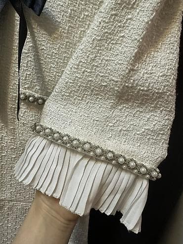 Ağ tüvit materialdan, klassik siluetli midi don. Brend: Julidress — 2