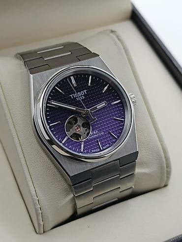 dini kartinkalar: Qol saatı, Tissot — 7