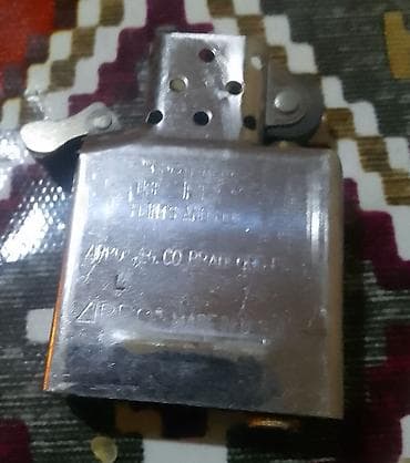 note tonal krem: Zippo benzinli alışqan - Brend: Zippo - Mənşə: Bradford, PA, Made in — 2