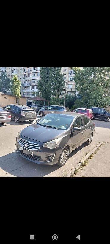 13 disk: Mitsubishi Attrage sedan - Kuzov: 4 qapılı sedan, tünd boz rəng - — 4