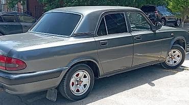 qara disk: GAZ Volga 31105 sedan - Kuzov: 4 qapılı sedan, tünd boz rəng, xrom ön — 3