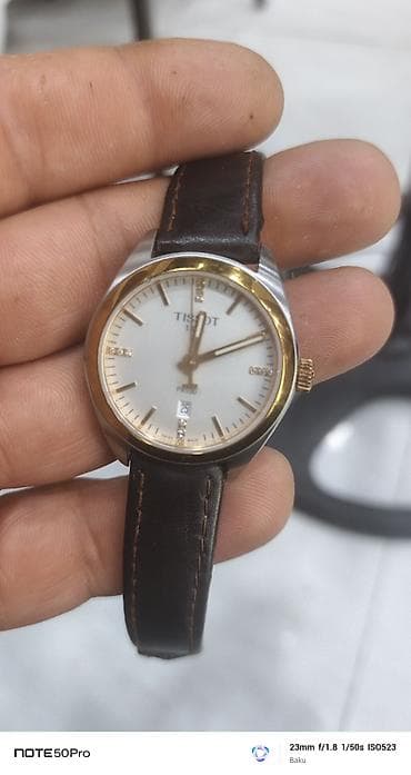 Наручные часы: Tissot PR100 qol saatı - Klassik dizayn: ağ siferblat, qızılı bezel — 1