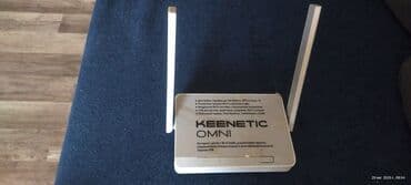 Ağ rəngdə Keenetic Omni brendinin routeri. Bu model iki xarici lalafo.az -da — 1 Ağ rəngdə Keenetic Omni brendinin routeri. Bu model iki xarici — 1