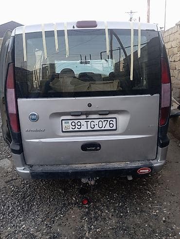 ford avtomobilleri: Fiat Doblo miniven Xüsusiyyətlər: - Gümüş rəngli kuzov, 5 qapı (yan — 2