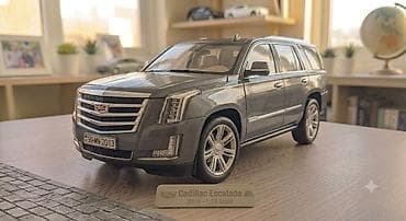 cd disk: Cadillac Escalade 2018 modelinin 1:18 miqyaslı kolleksiya modeli. SUV — 1