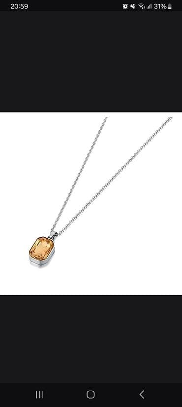 Zərgərlik dəsti – gümüş rəngli metal üzərində kəhrəba tonlu kristallar