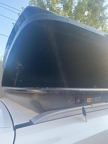 eşşək arabası: Avtomobil üçün dam üstü baqaj qutusu (roof box). Aerodinamik formalı — 3