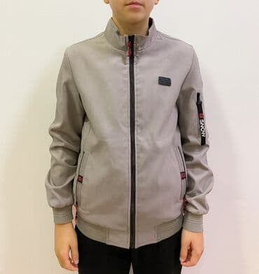 Uşaq gödəkçəsi – boz rəng, idman tərzində. 14-15 yaşa olan . İki